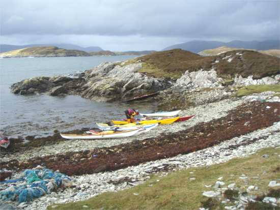 Kayaks on beach, NW Scotland